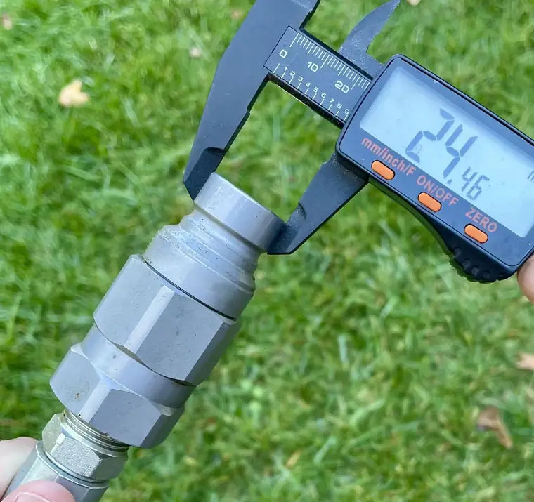 Example photo 2: digital calipers measuring across the male coupler end diameter, reading 24.46 mm